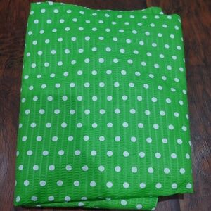 lime green polka dot textured fabric